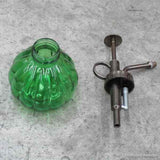 Green Glass Bottle and Sprinkler Head